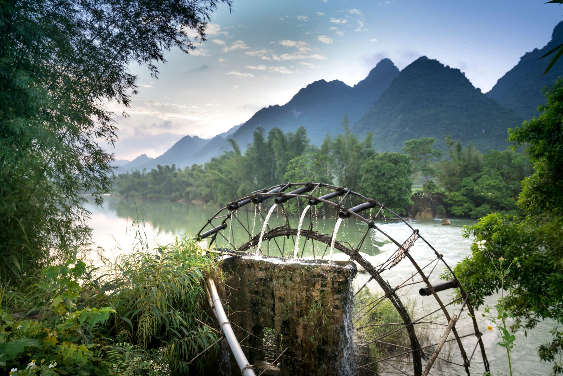 Canal and watermill in Lijiang Old Town at dawn