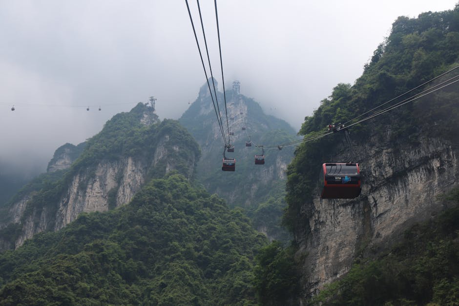 Cable car ascending toward Tianmen Mountain through clouds