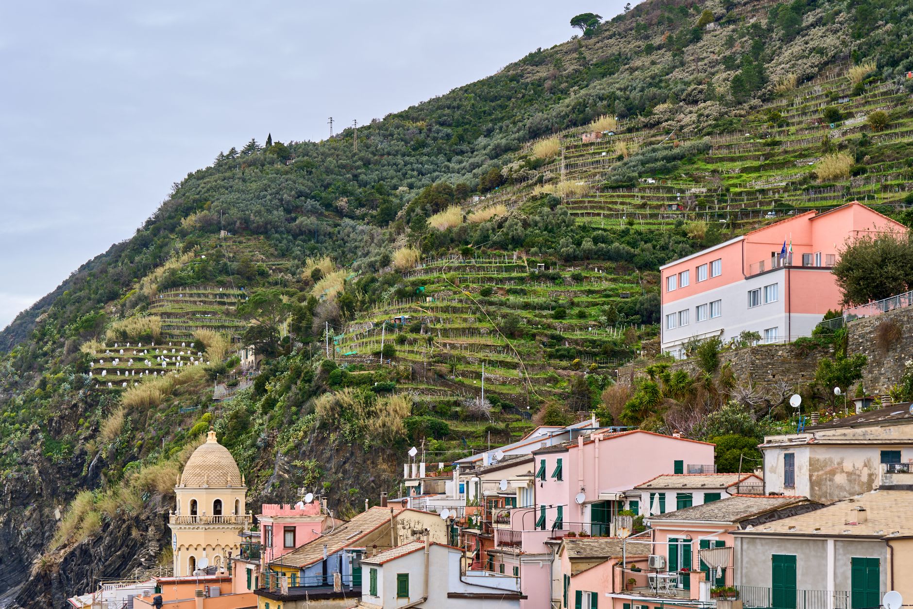 The path rounding the Manarola promontory with the harbor village appearing below in the late morning light
