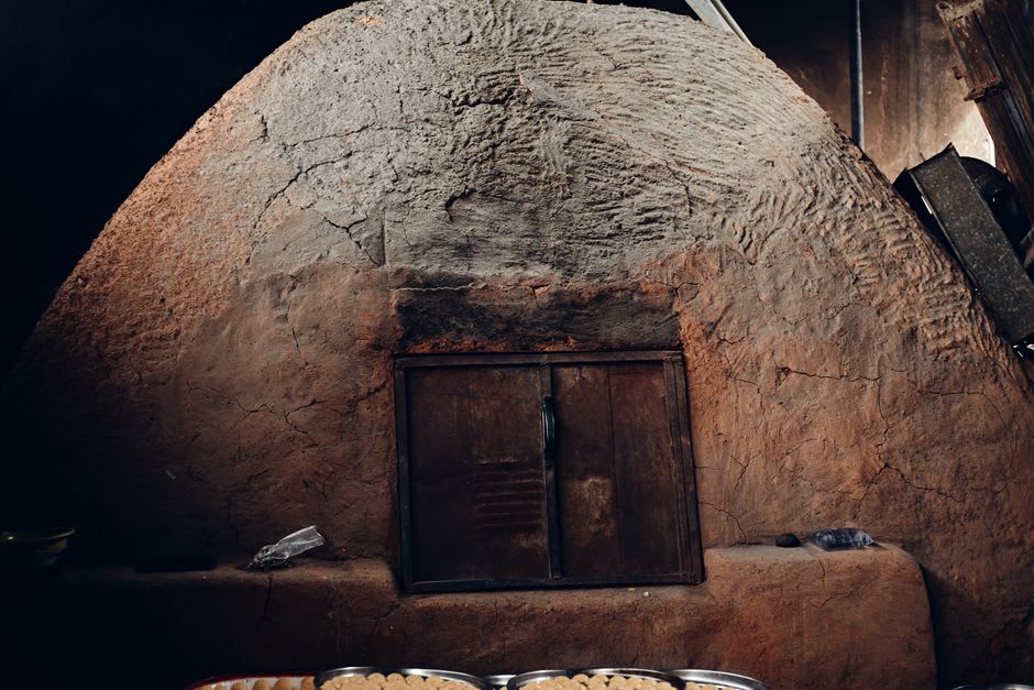 Steam rising from an umukai earth oven being uncovered at Te Vara Nui Village