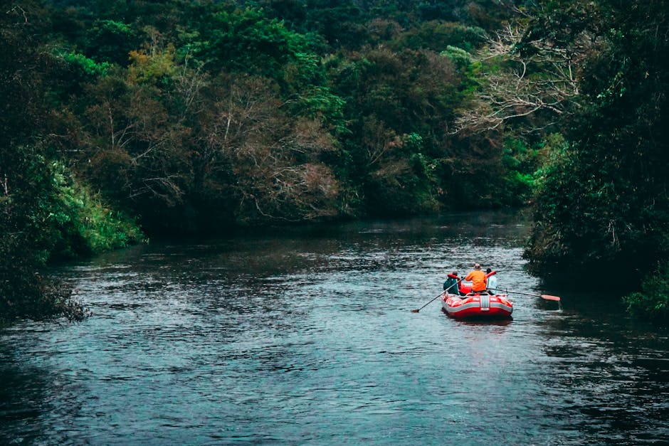 White water rafting through a jungle river canyon