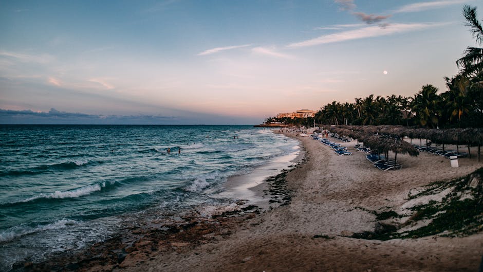 Caribbean beach with turquoise water and resort coastline