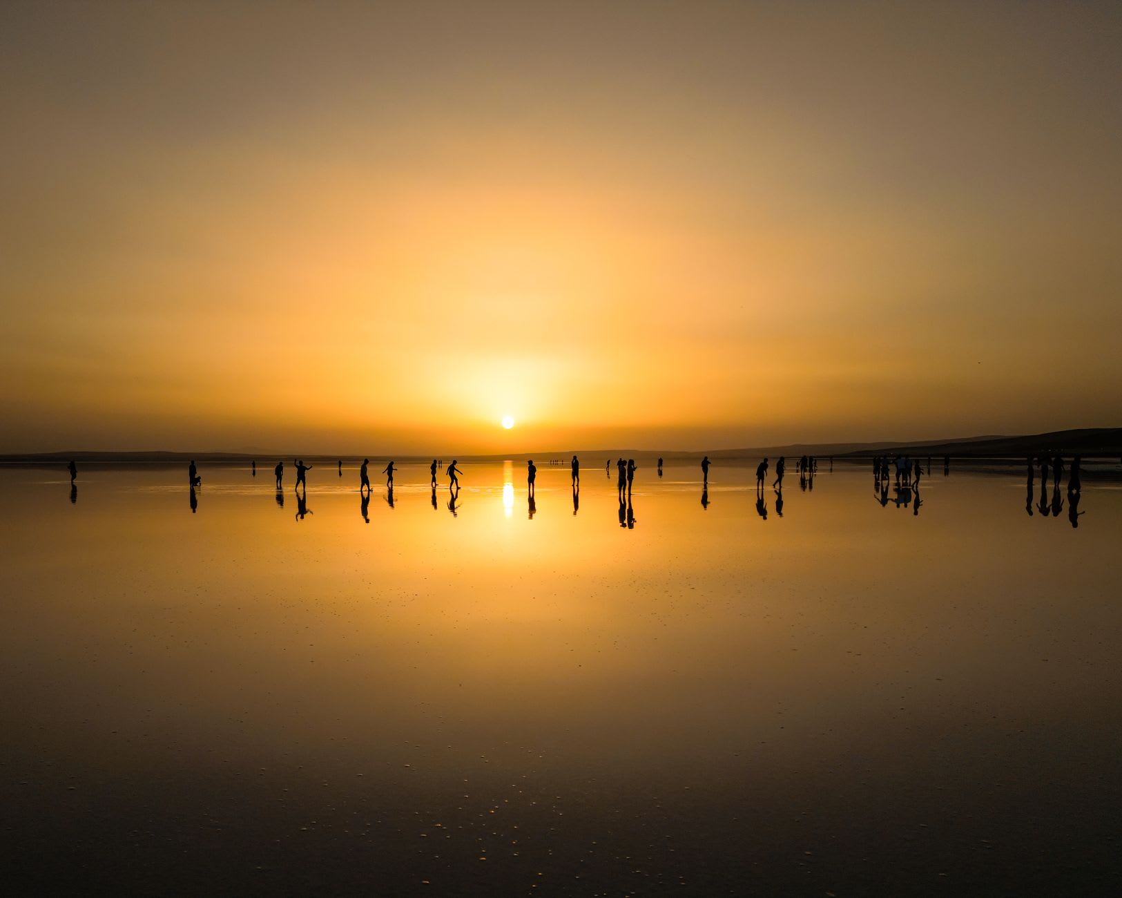 Limestone chimneys rising thirty meters from the pale flats, steam curling in the morning light