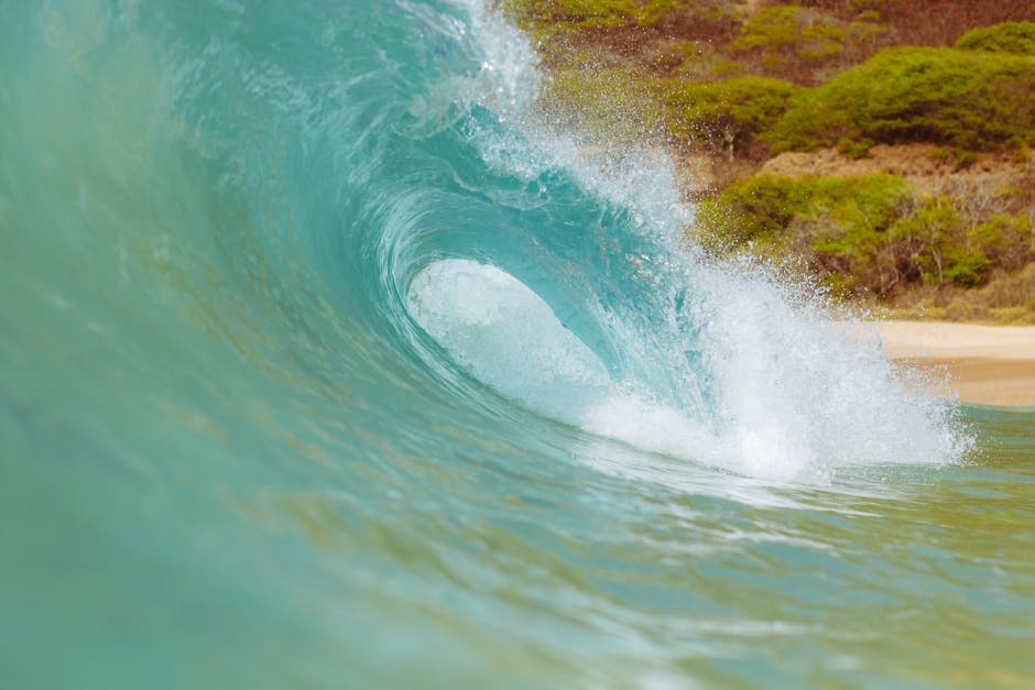 Surfer riding waves at a tropical beach break