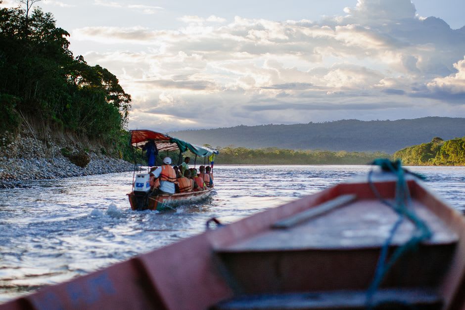 A raft crew paddling through Class III whitewater on the Jatunyacu River outside Tena