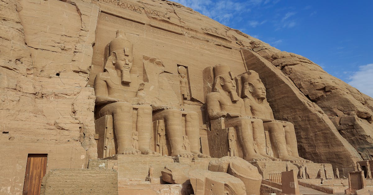 The colossal facade of Abu Simbel temple on the shore of Lake Nasser