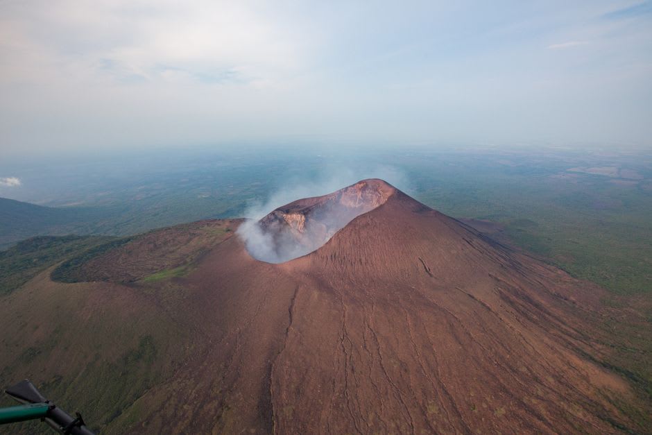 The inner secondary cone of El Boquerón crater, densely forested and nested inside the larger outer crater rim