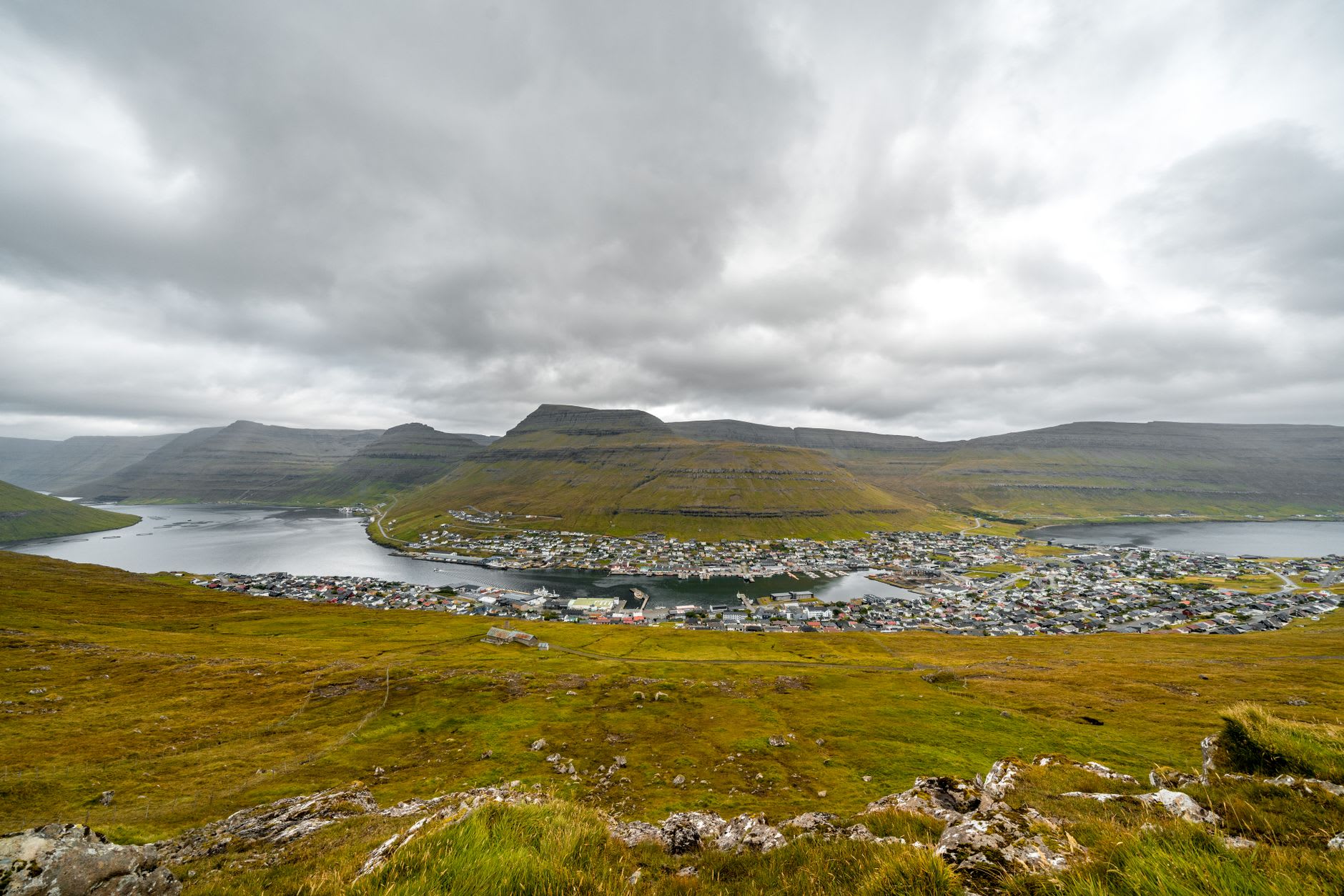 The lake of Sørvágsvatn appearing to hover above the Atlantic in soft morning mist from the ridge viewpoint
