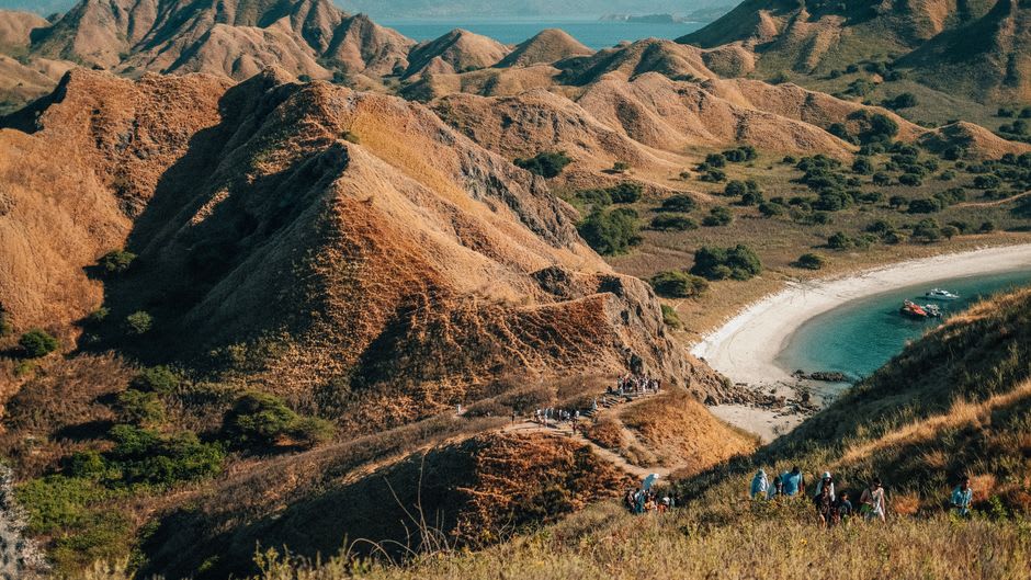 Sunrise light hitting the ridgeline trail on Padar Island