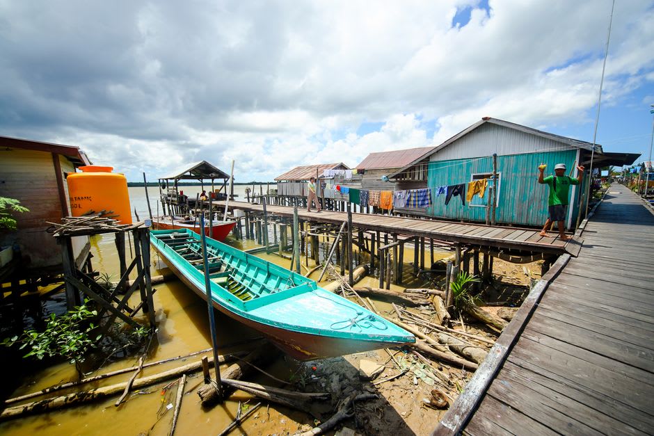 Stilt houses of the Bajau and Bugis fishing village of Kampung Rinca seen from the savanna trail
