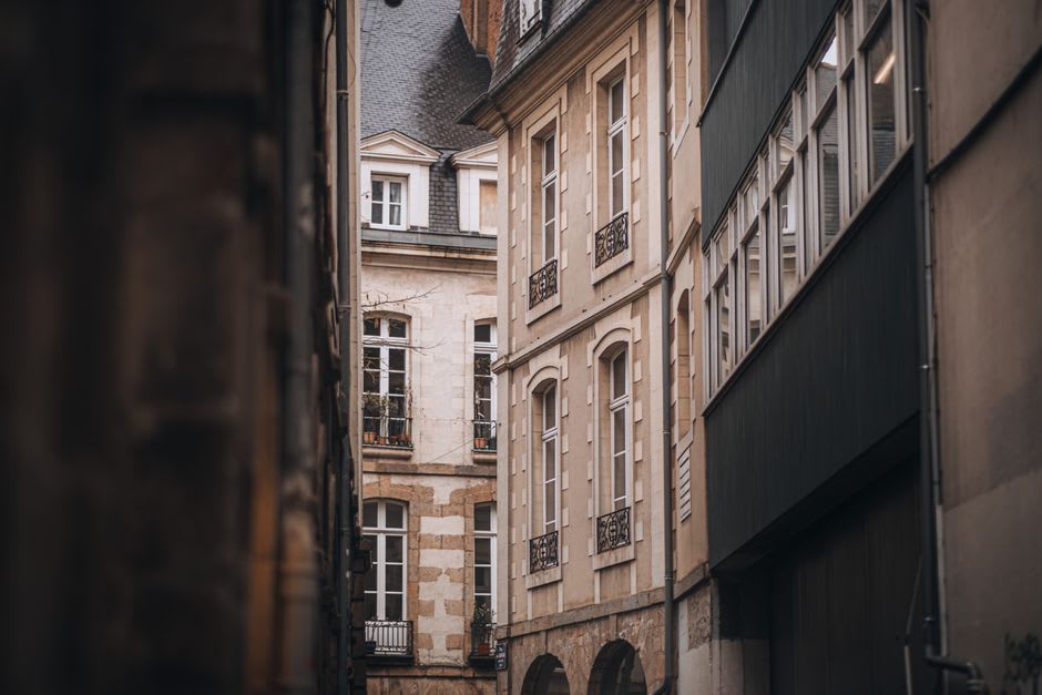 The stone buildings and narrow streets of Aurillac's historic center along the Jordanne river