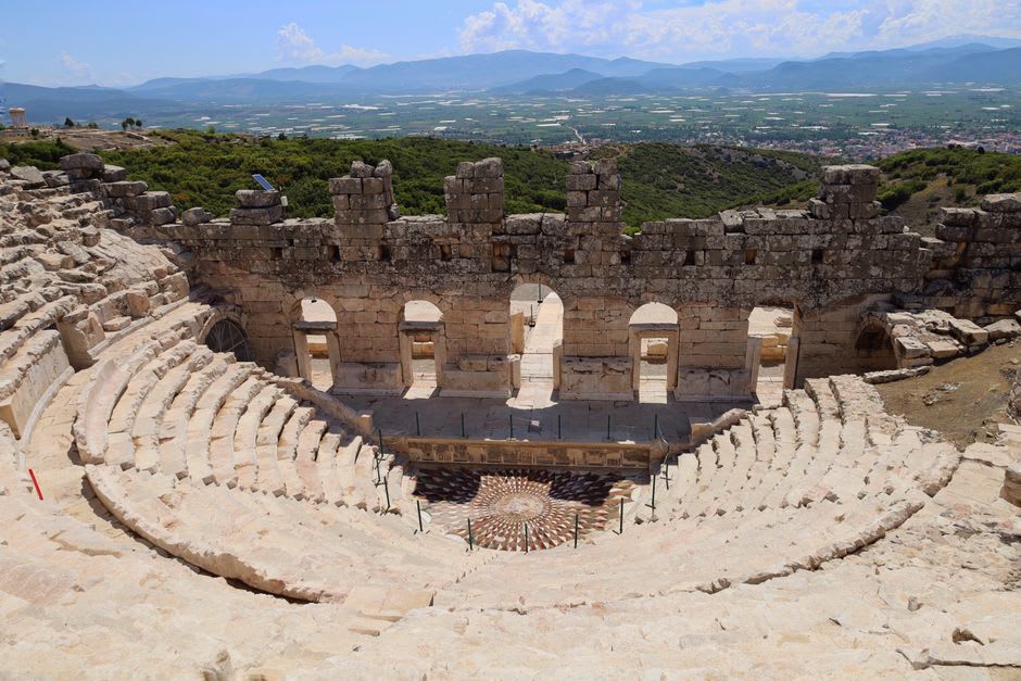 The tiered stone seating of the Roman theatre in Autun cut into the hillside