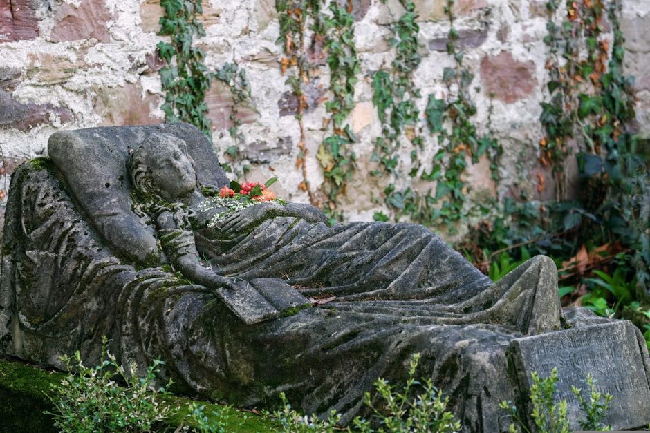 The simple ivy-covered adjoining graves of Vincent and Theo van Gogh in the Auvers-sur-Oise cemetery