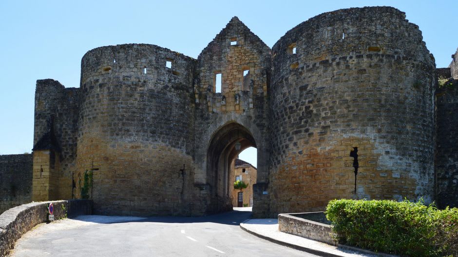 The severe grey stone walls of the eleventh-century Tour César keep rising above Beaugency's old town