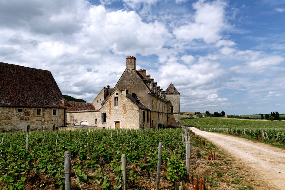 The fortified Château de Monbazillac standing above rows of vineyards south of Bergerac