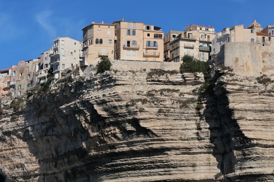 The 187 stone steps of the Escalier du Roi d'Aragon cut into Bonifacio's cliff face down toward the sea