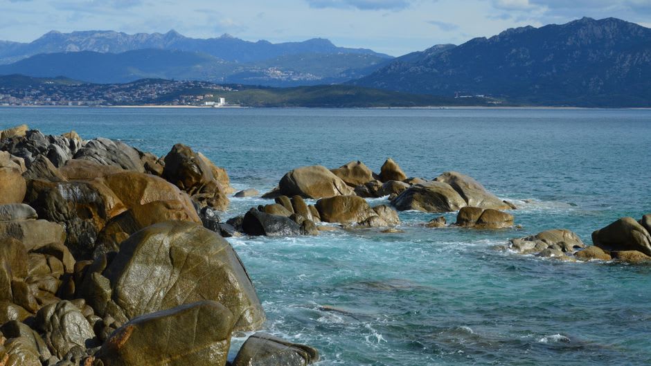 Turquoise water and granite rocks of the Îles Lavezzi off the coast near Bonifacio