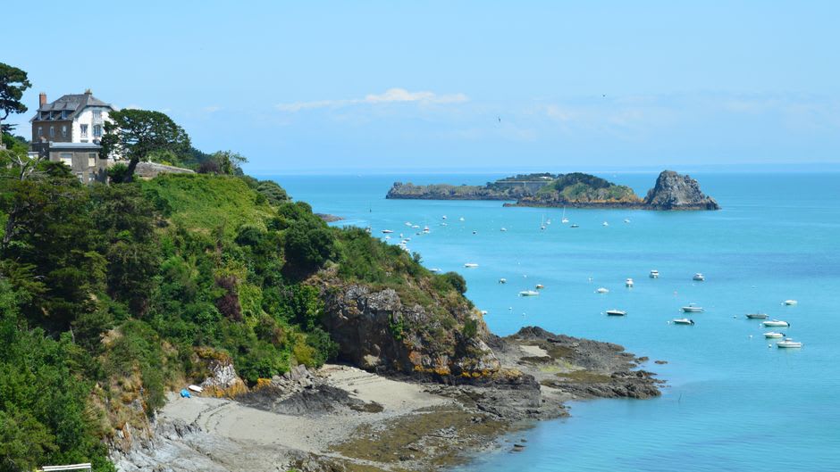 The clifftop coastal path GR34 above Cancale looking out toward Pointe du Grouin and the bay