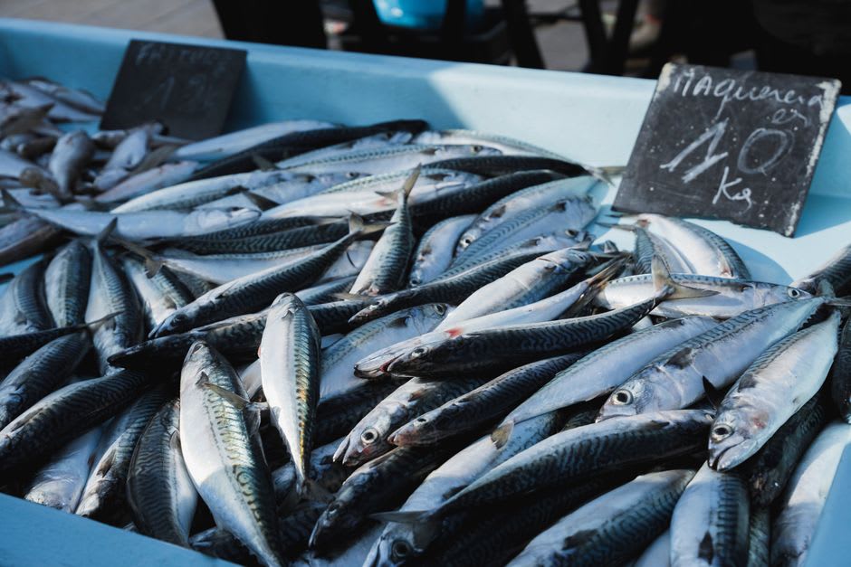 Fishmongers and produce stalls at the covered Marché Forville in the old Suquet quarter of Cannes