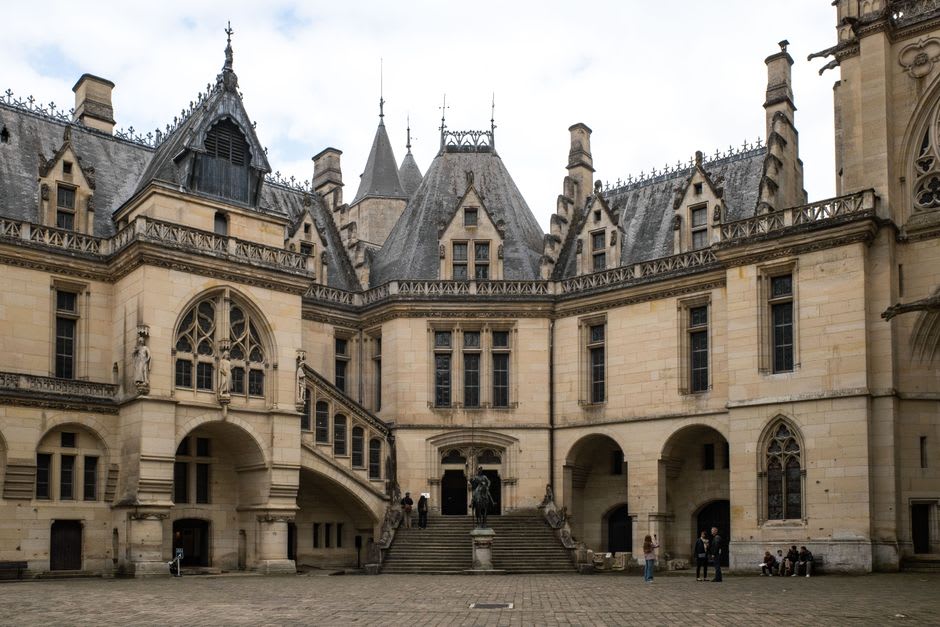 The Gothic Sainte-Chapelle tower and stone courtyard of the Château des Ducs de Savoie in Chambéry
