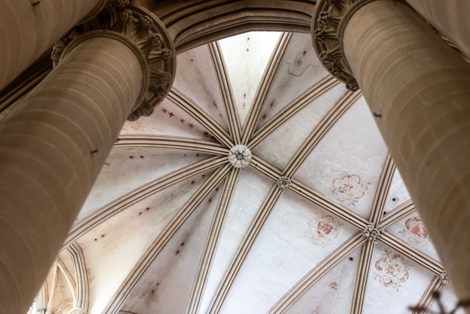 The soaring Gothic lantern tower and nave of Coutances Cathedral seen from below