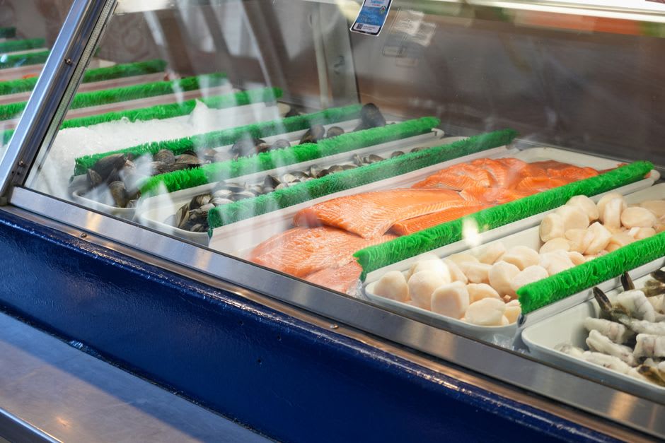 Fresh scallops and shellfish displayed at a harbourside seafood stall in Dieppe