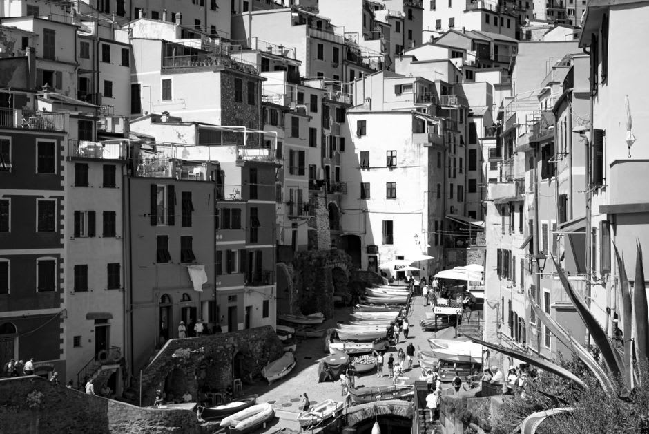 Fishing boats pulled up on the narrow concrete slipway between the tall houses of Erbalunga