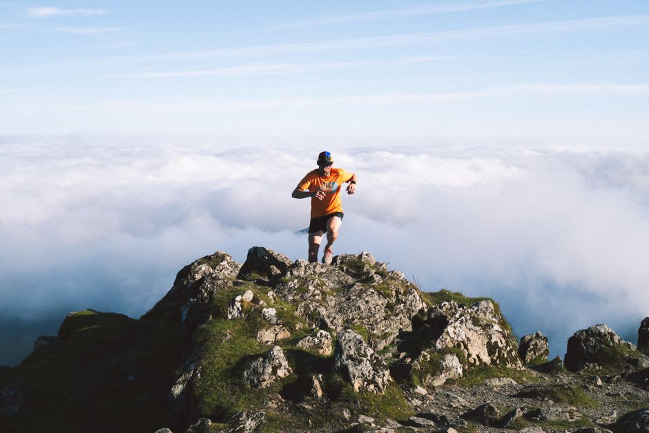 Runners training on an open altitude track on the sunlit Cerdagne plateau above Font-Romeu