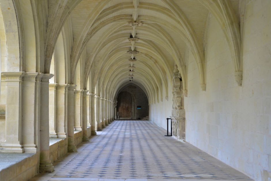 The painted stone effigies of Eleanor of Aquitaine and Henry II lying in the nave of Fontevraud Abbey