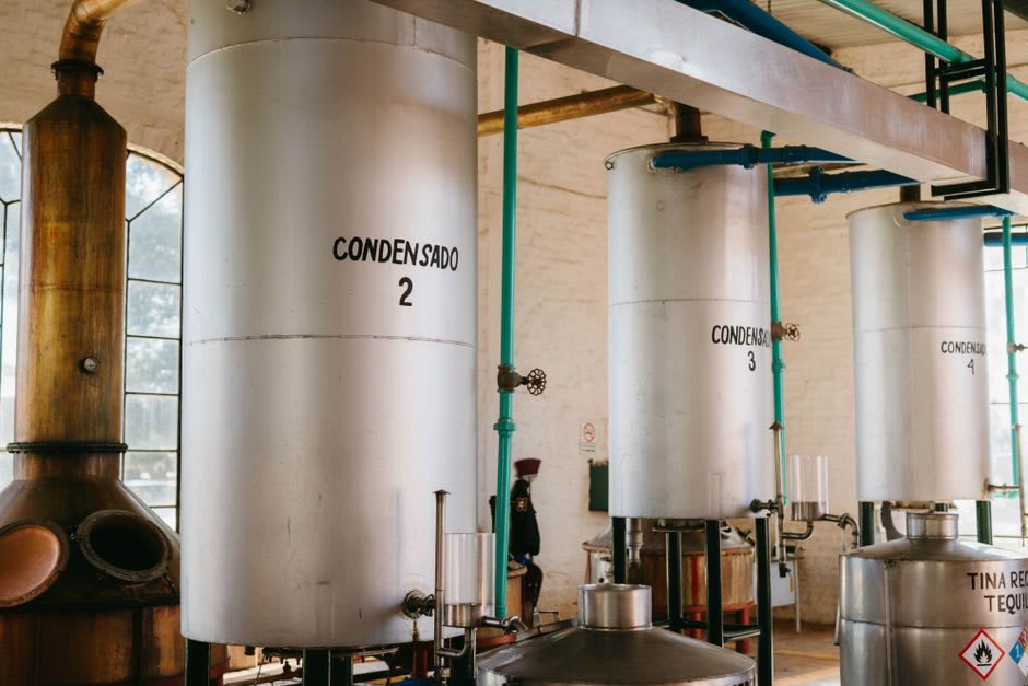 Rows of copper distillation stills inside a historic perfume factory in Grasse