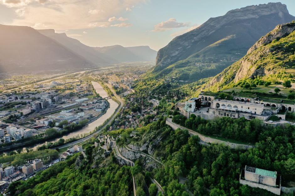 One of the round glass cable car "bubbles" ascending the cliff above Grenoble toward the Bastille fort