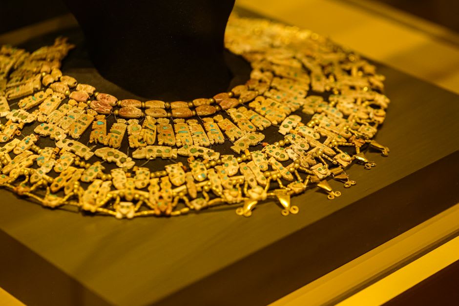 A case of golden prehistoric flint blades displayed at the Le Grand-Pressigny museum