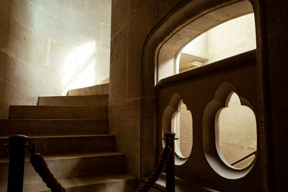 The spiral stone staircase inside the Renaissance wing of Château de Lourmarin