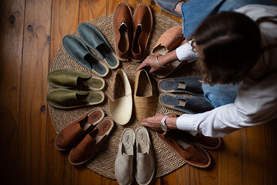 Rows of hand-braided jute soles drying in a small espadrille workshop in Mauléon