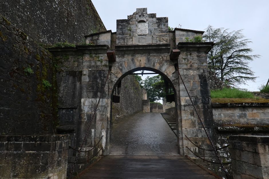 One of the surviving medieval gates at the edge of Monpazier's fortified bastide walls