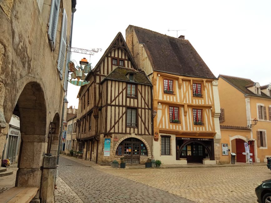 Timber-framed medieval houses on stone arcades in the main square of Noyers-sur-Serein