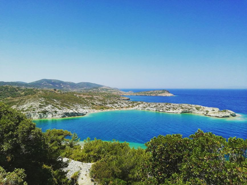The clear turquoise coves of the Isolella peninsula near Porticcio, fringed by pines and pale sand