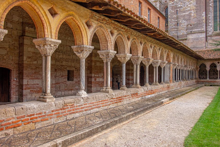 The pink marble Romanesque cloister of the Abbaye Saint-Michel-de-Cuxa below Mount Canigou