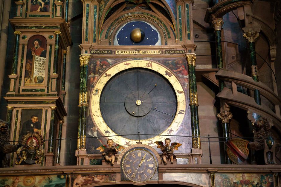 The Renaissance Gros-Horloge astronomical clock spanning a cobbled street in Rouen