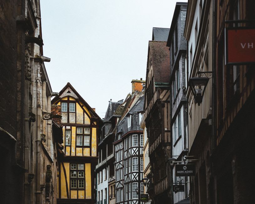 Timber-framed houses lining a narrow street near the Place du Vieux-Marché in Rouen