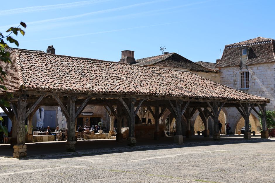 The stone arcades of the medieval Halle au Blé market hall in Rouffach, Alsace