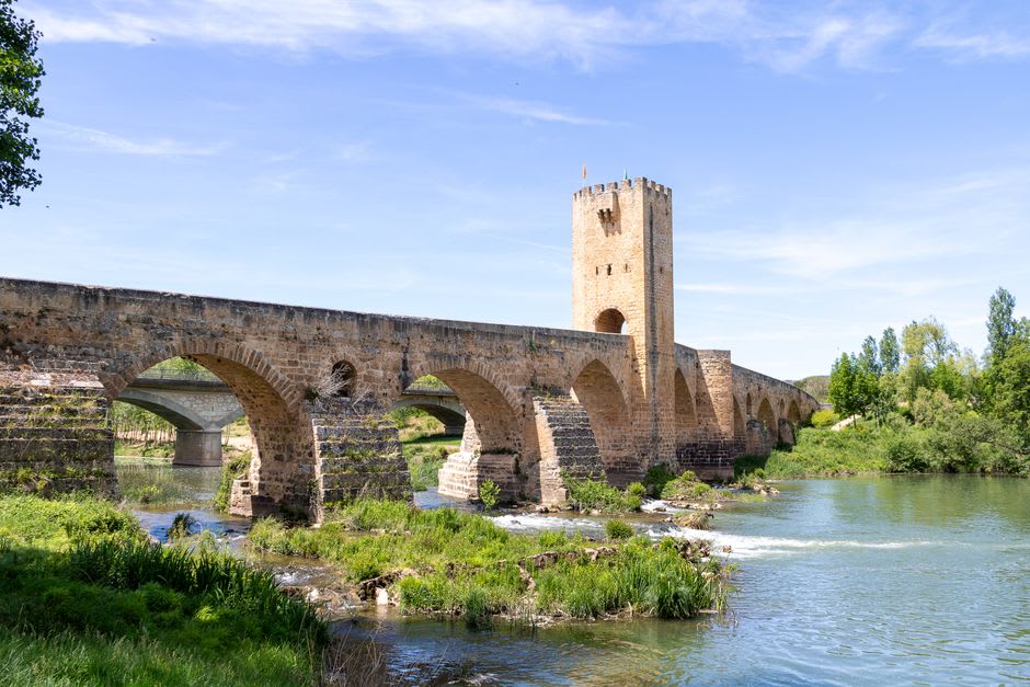 The eleven-arch Old Bridge of Sospel spanning the Bévéra river with its central medieval toll tower
