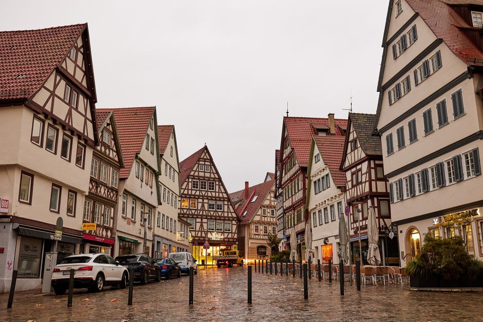 Steep, half-timbered medieval houses lining one of Thiers' cutlery-shop streets on the hillside