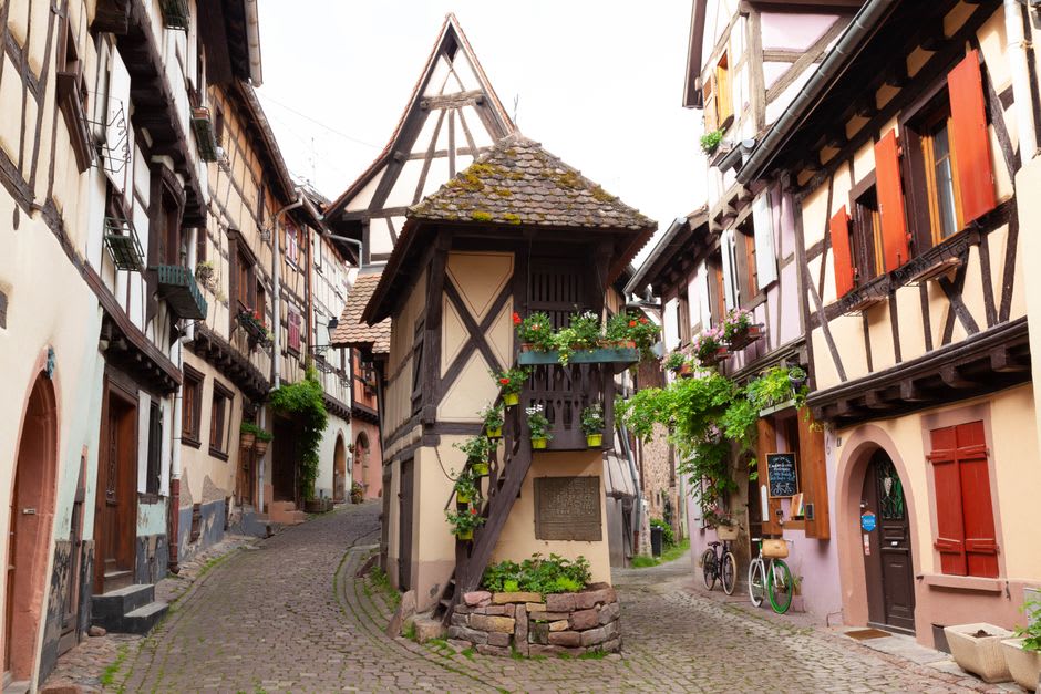 The narrow medieval Ruelle des Chats in Troyes with timber-framed upper floors nearly touching overhead