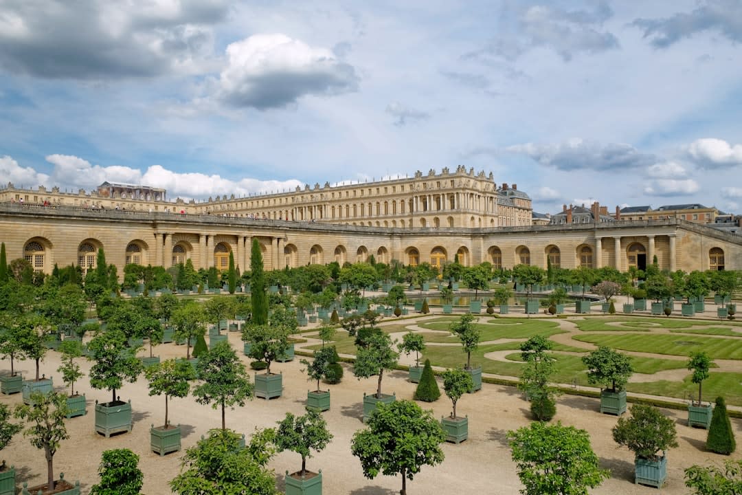 The mirrored arches and gilded ceiling of the Hall of Mirrors at the Château de Versailles