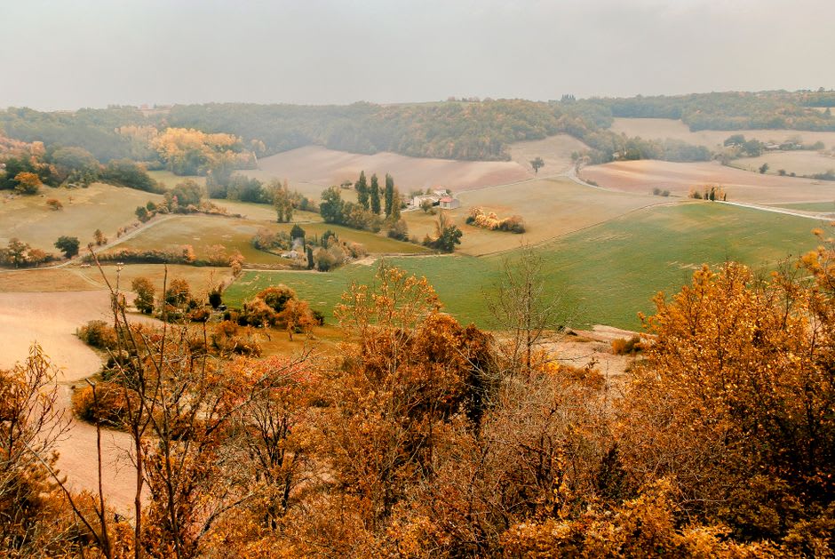 The view over the green Cure valley and Morvan hills from the terrace behind Vézelay's basilica