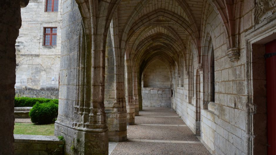 The dim, vaulted medieval passage of the Rue Obscure running beneath the old town of Villefranche-sur-Mer