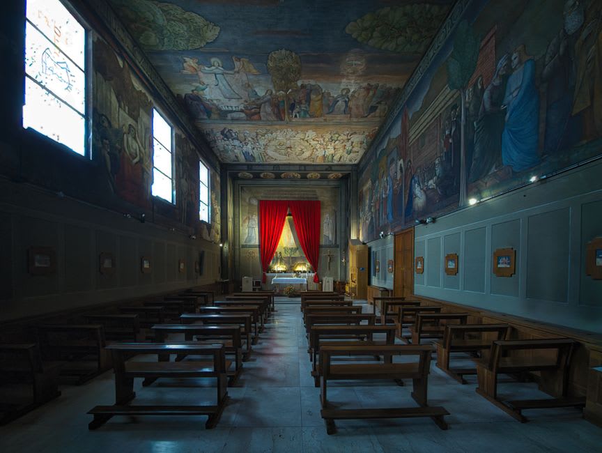 The interior of the small Chapelle Saint-Pierre in Villefranche-sur-Mer, its walls covered in Jean Cocteau's murals