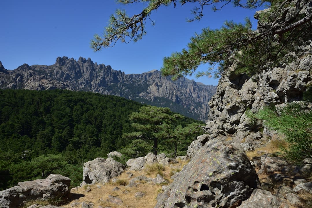 The pass at Col de Bavella with the granite Aiguilles rising directly behind a small roadside chapel