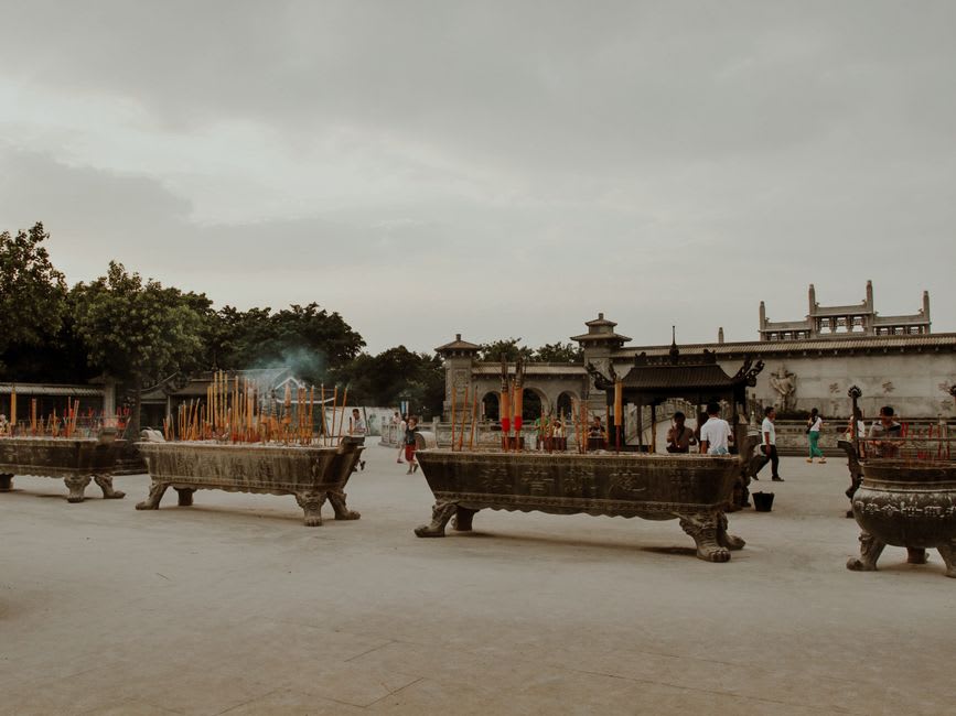 Stone steps leading up Gushan mountain toward Yongquan Temple with incense smoke rising